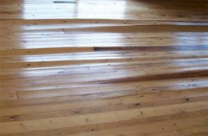 A wooden floor with many steps and some wood flooring